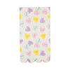 Paper napkin with pastel conversation hearts on a white background