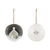 Decorative Christmas ornament with a nativity scene and text on a white background