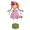 Decorative figurine with a floral headpiece and pink dress on a white background