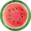 Round paper plate with sliced watermelon with green rind on a white background