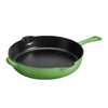 Green cast iron skillet on a white background