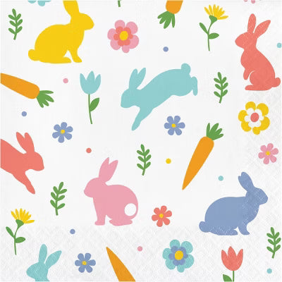 Colorful napkin with bunnies, carrots, and flowers on a white background