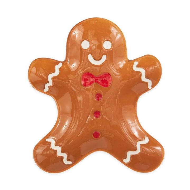 A spoon rest in the shape of a gingerbread man.
