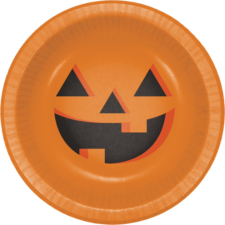 An orange paper bowl featuring a jack-o'-lantern face design in black and orange, isolated on a white background.