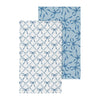 Two fabric swatches with blue bow patterns on a white background