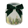 Decorative jar with a forest design and a green bow on a white background