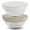 Two white bowls with fabric beeswax bowl covers on a white background