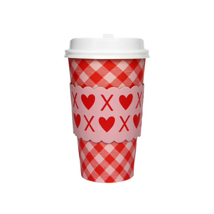 Red and white checkered cup with heart and cross pattern on a white background