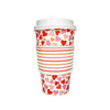 Colorful paper cup with heart and stripe pattern on a white background