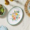 Decorative plate with floral design on a tablecloth