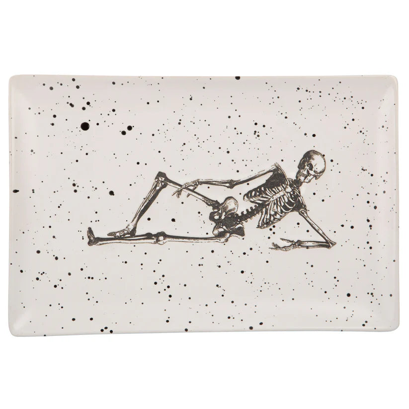 Rectangular platter with a black skeleton design on a speckled beige background