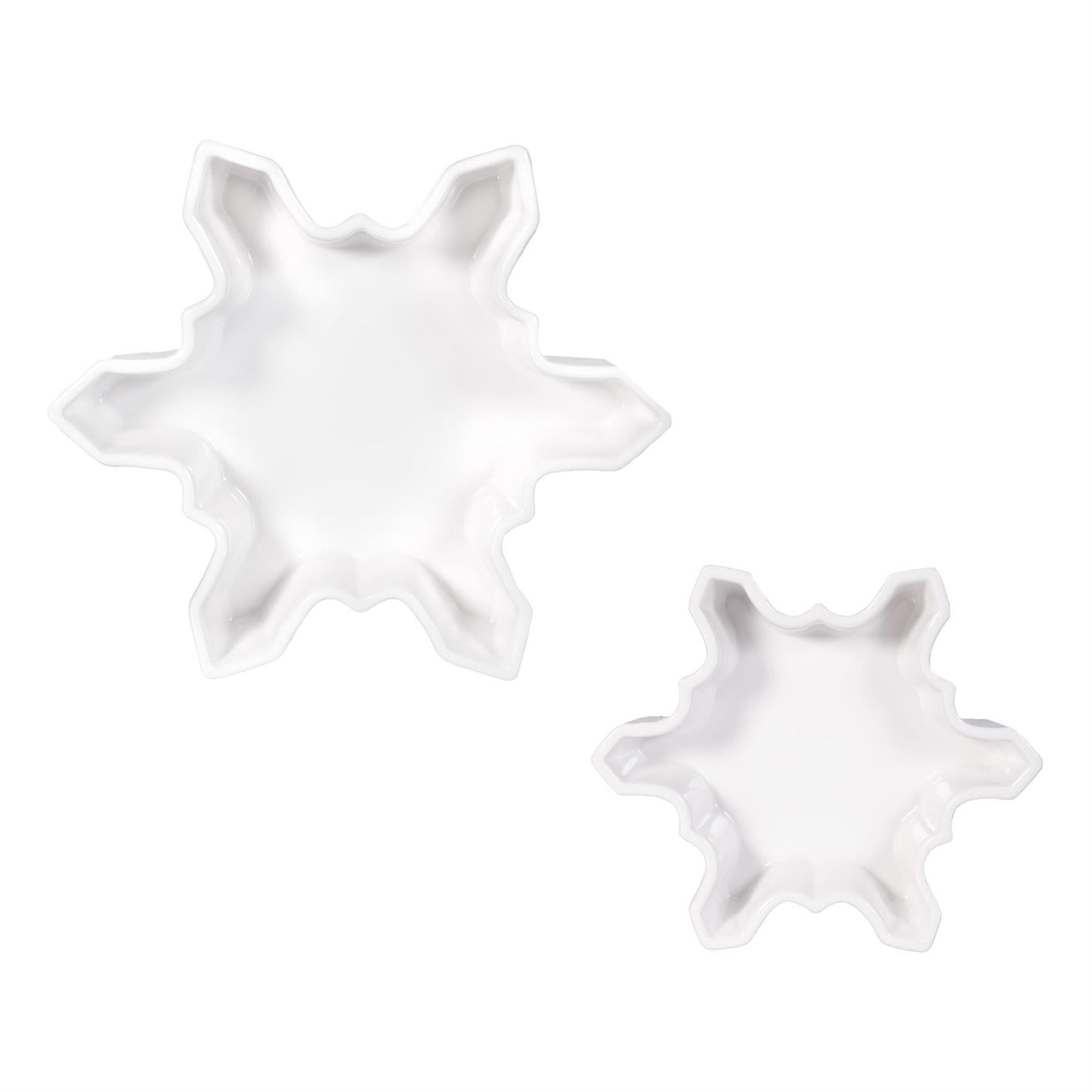 Two white snowflake-shaped bowls on a white background