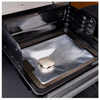 Grill with a protective liner in the bottom.