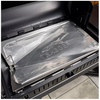 Protective grill liner installed in grill base