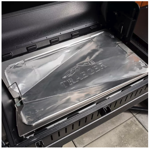Protective grill liner installed in grill base