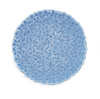 Round blue trivet with floral pattern on a white background