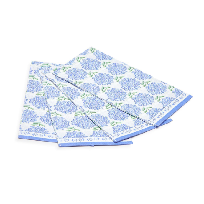 Set of three blue floral patterned napkins on a white background