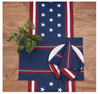 Napkin, table runner and placemat with American flag design on a wooden surface