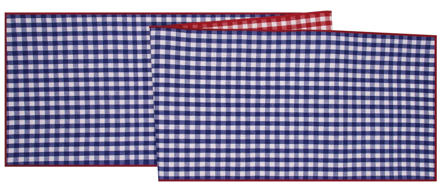 Blue and white checkered table runner with red border on a white background