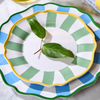 Decorative plates with green leaf on a marble surface
