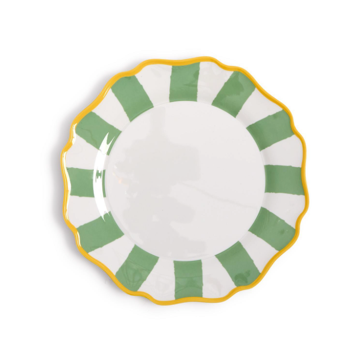 Decorative plate with green and yellow rim on a white background