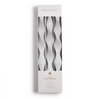 Three white twisted candles in a white box with 'Two's Company' branding on a white background.