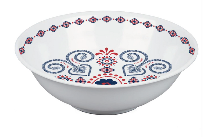 White bowl with blue and red floral patterns on a white background