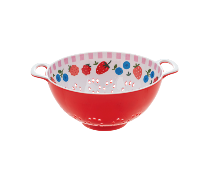 Red colander with white interior, colorful fruit pattern, and handles on a white background