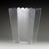 Clear scalloped edge container on a dark background
