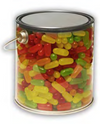 Clear plastic paint can filled with colorful candy on a white background