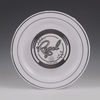 White plastic plate with silver trim with 'Regal' branding on a gray background