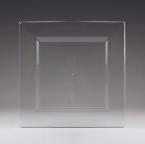 Clear square plastic plate on a dark background