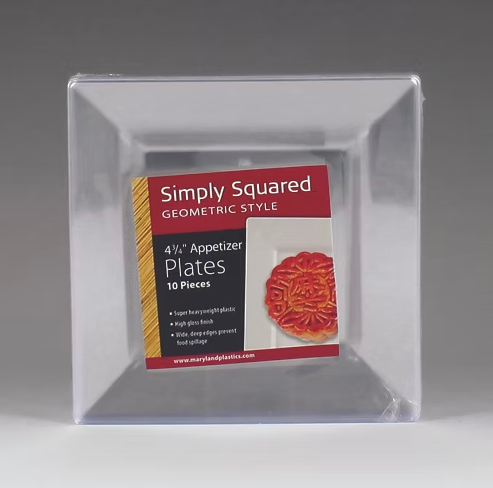 Packaging of Simply Squared geometric style plates with a clear lid.