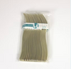 Packaged gold forks with a visible brand label on a white background