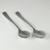 Two silver spoons on a white background