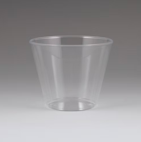 Clear plastic cup on a gray background