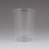 Clear plastic cup on a gray background