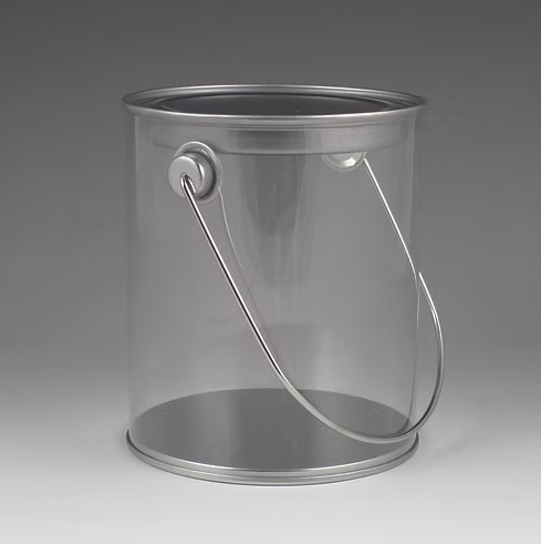 Clear plastic paint can with metal handle on a gray background