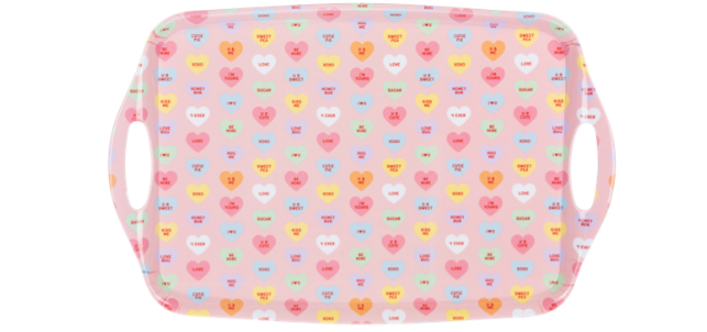 Pink tray with heart patterns on a white background