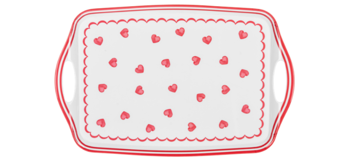 Rectangular serving platter with red heart pattern on a white background