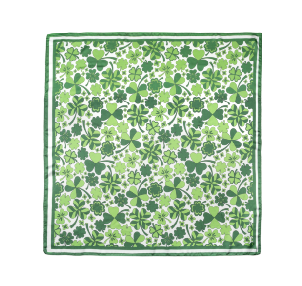 Green and white patterned scarf with clover leaves on a white background