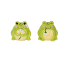 Two green frog-shaped salt and pepper shakers on a white background