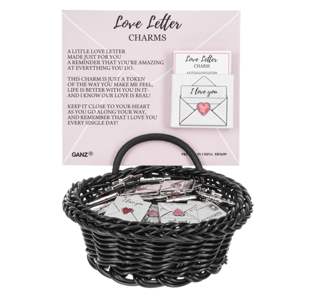 Black wicker basket with 'Love Letter' charms on a white background