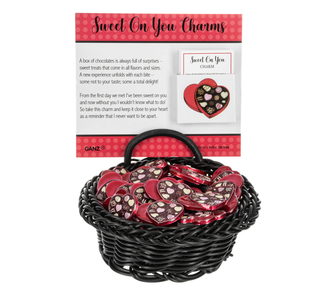 Basket of 'Sweet On You' charms with packaging on a white background