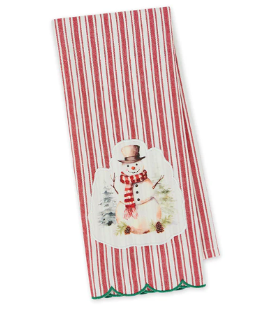 A red and white vertically striped kitchen towel featuring a central illustration of a snowman wearing a top hat and red-and-white striped scarf, with a green scalloped edge at the bottom.