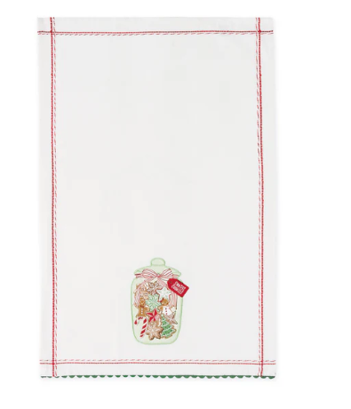 A white kitchen towel with scalloped edges, featuring an embroidered design of a glass jar filled with holiday cookies and a red ribbon bow, with red and green stitched borders.