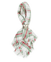 Red, white and green Christmas theme napkin with a silver napkin ring around the center.