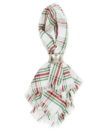 Red, white and green Christmas theme napkin with a silver napkin ring around the center.