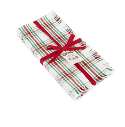 A set of four folded Christmas themed napkins in red, white and green plaid pattern.