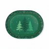 A green oval holiday party plate with a border of snowflakes and three Christmas trees in the center, shown on a white background.